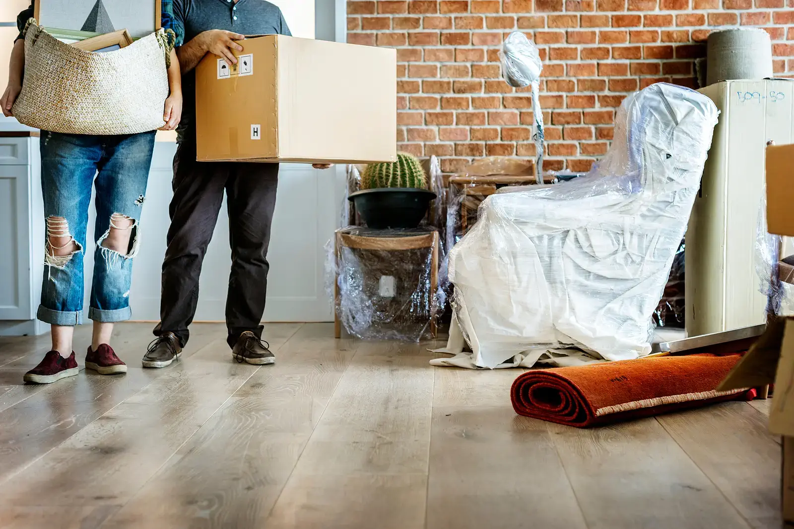 S.B. Movers team packing and lifting boxes for a long-distance move, ensuring safe and organized transportation from Vaughan to any destination